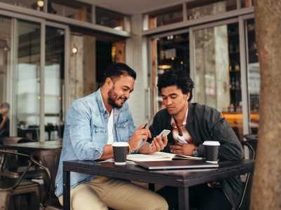 Two men having coffee at Heron Creek Apartments in Moses Lake, Washington