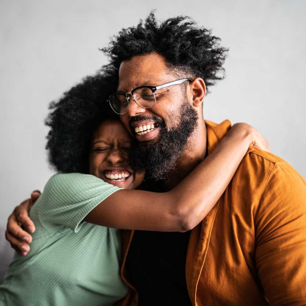 Happy couple hugging at Cadillac Flats in Napa, California