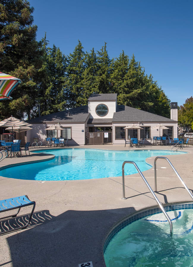 Resort-style swimming pool during the day at Hidden Lake Condominium Rentals in Sacramento, California
