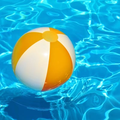 Beach ball floating in swimming pool at Stuart Mesa in Oceanside, California