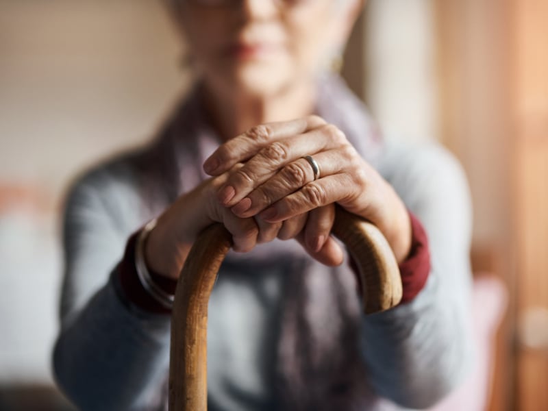 A resident with a cane at Maple Ridge Senior Living in Ashland, Oregon