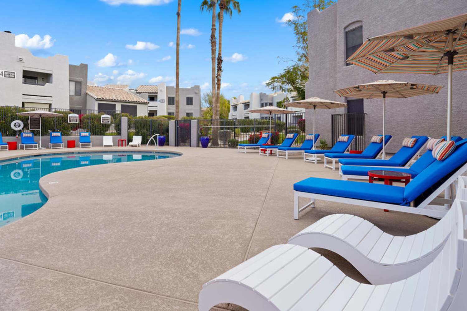 Lounge chairs by the pool at Cabrillo Apartments in Scottsdale, Arizona