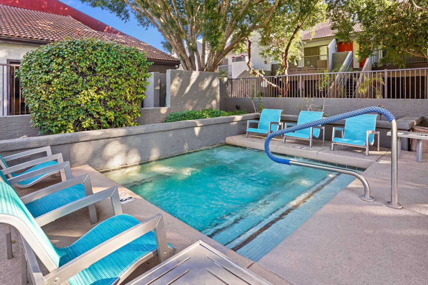 Community spa with seats at Waterford Place Apartments in Mesa, Arizona