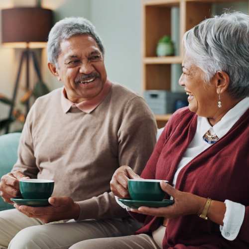 Couple having a cup of coffee at their home at Homestead Village Pensacola in Pensacola, Florida