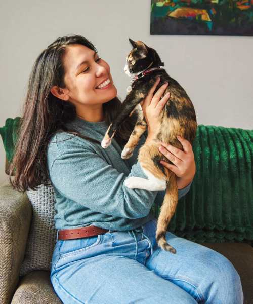 Resident playing with her pet cat at Isles at East Millenia in Orlando, Florida