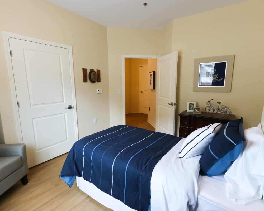 A decorated bedroom at The Harmony Collection at Roanoke - Memory Care in Roanoke, Virginia