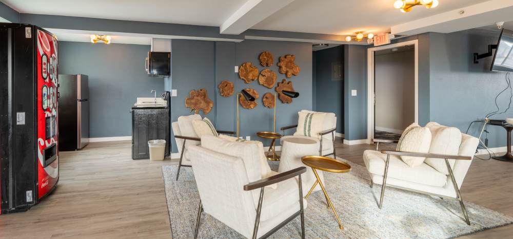 Socialize, grab a drink or play games in the community room at Thea Apartments in Tacoma, Washington