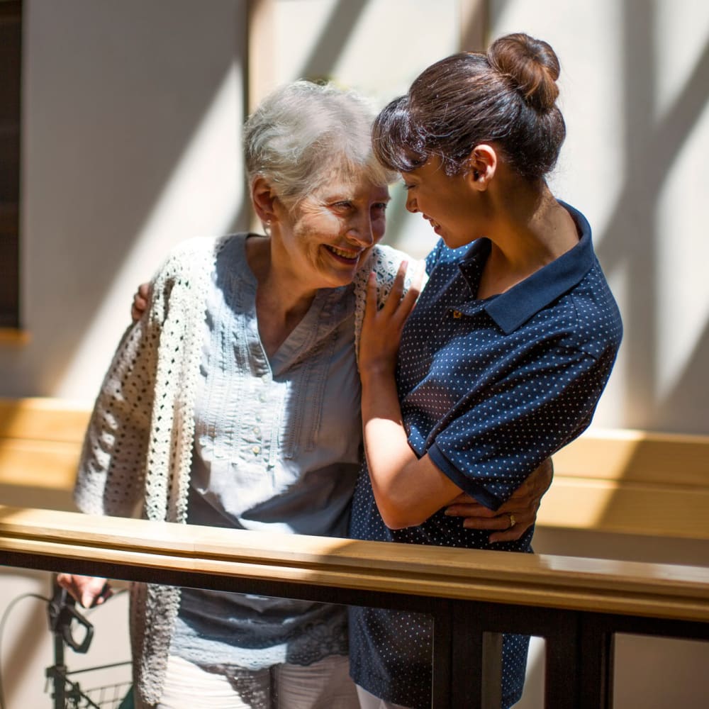 A staff member helping a resident at The Ridge at Madison in Fitchburg, Wisconsin