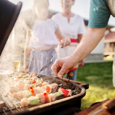 Grilling food at a resident event at Orleck Heights in San Diego, California