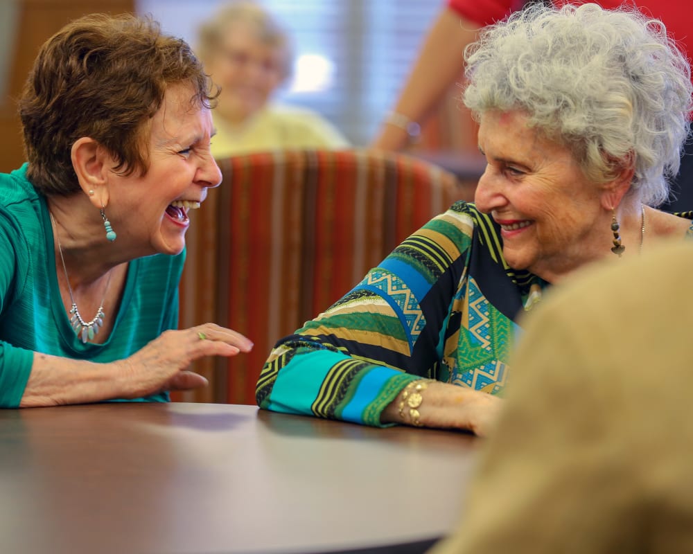 Residents laughing together at Harmony at Brookberry Farm in Winston-Salem, North Carolina