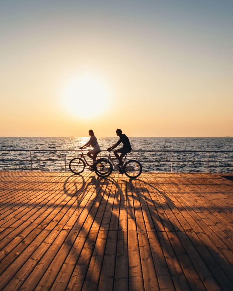Residents going for a bike ride on a pier near The Jessica Apartments, Los Angeles, California