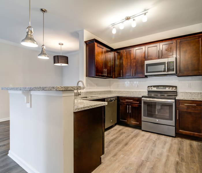 Modern kitchen with stainless-steel appliances in model home at Richland Falls in Murfreesboro, Tennessee