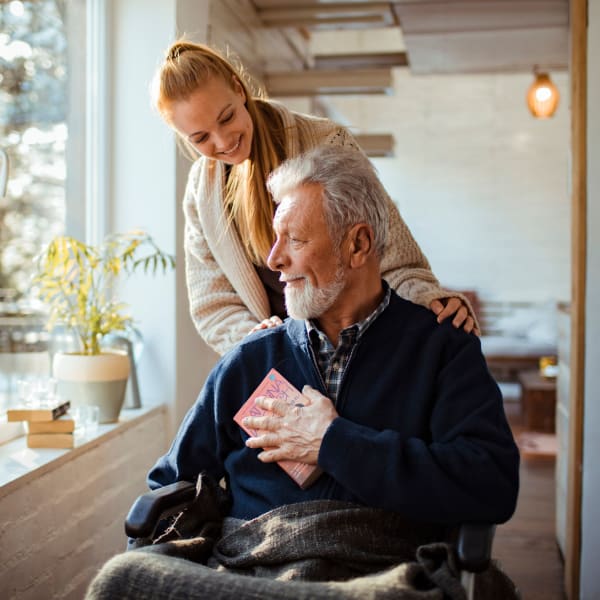 A resident looking out the window at Serra Highlands Senior Living in Daly City, California.