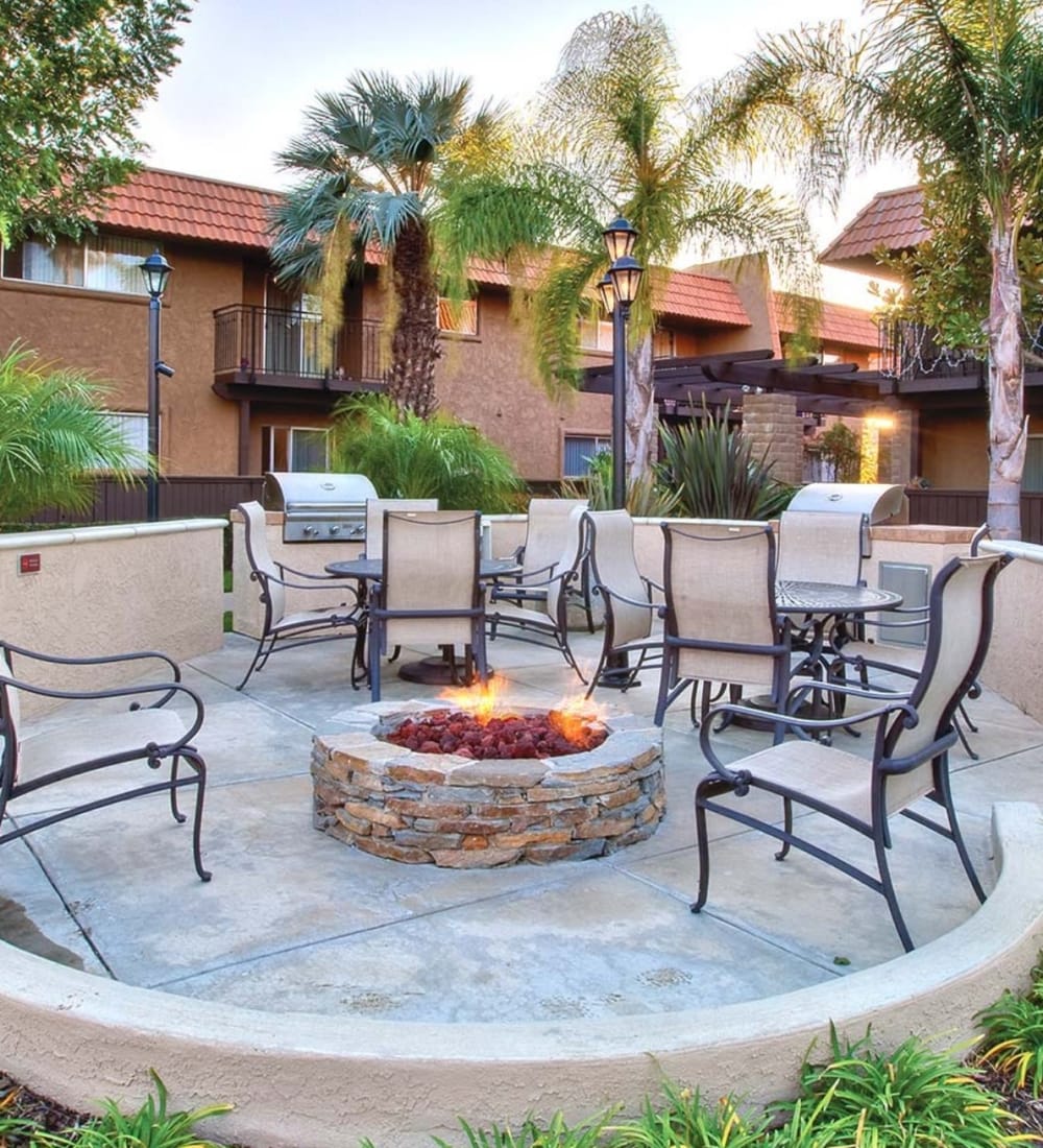 Fire pit surrounded by comfortable chairs at Terra Camarillo in Camarillo, California