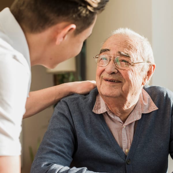 Caregiver and resident at The Club at Lake Wales in Lake Wales, Florida