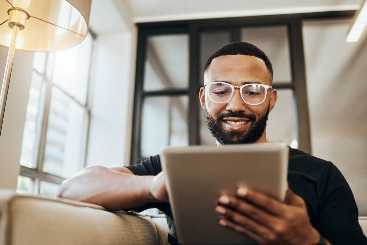 Resident using tab at Hampton Chase in Palestine, Texas