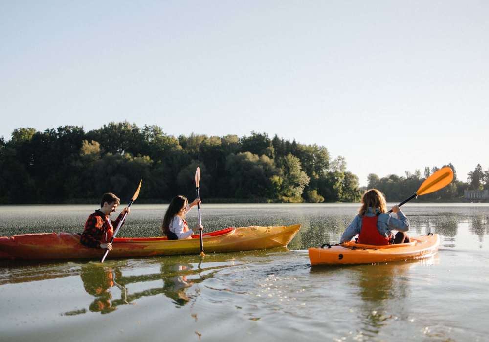 Resident friends kayaking in lake near The Reserve at Kanapaha in Gainesville, Florida