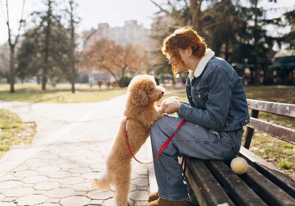 Resident woman with her dog at Oak Hill in Escondido, California