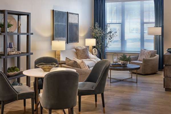 Modern living room with cozy seating and decor at Waltonwood Lead Mine in Raleigh, North Carolina