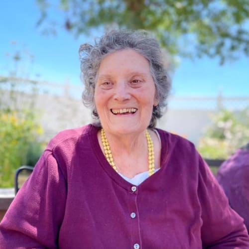 Resident smiling outside at Oxford Glen Memory Care at Owasso in Owasso, Oklahoma