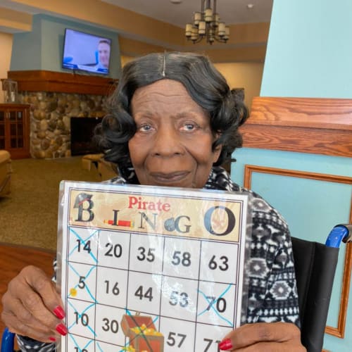 Resident crafting at Oxford Glen Memory Care at Carrollton in Carrollton, Texas