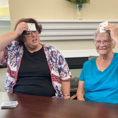 Caregiver with resident goody bag at Madison House in Norfolk, Nebraska