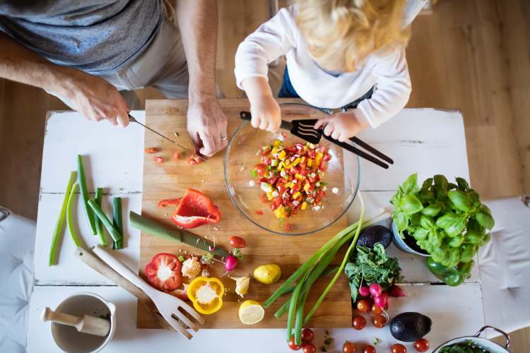 Parent and child prepping food at Windfern Meadows in Houston, Texas