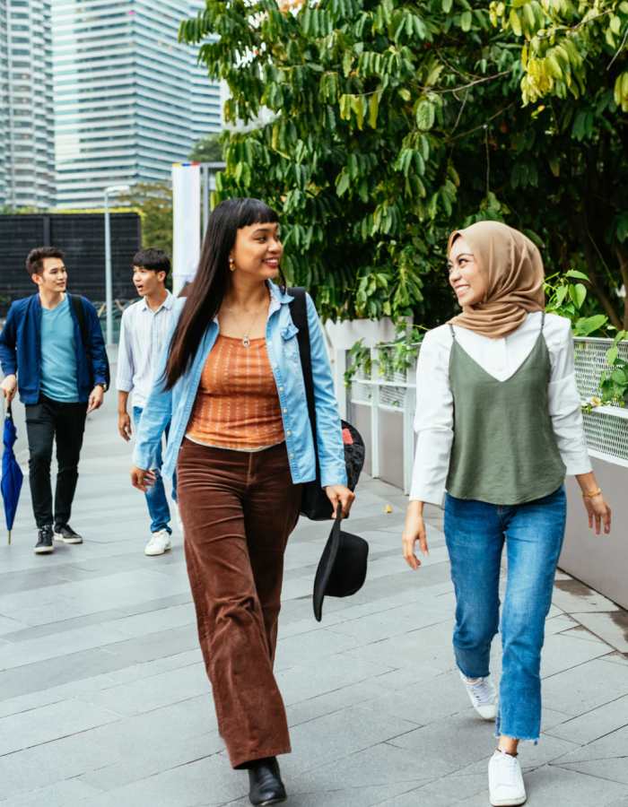 Residents walking at a college campus near Copper Beech Town Homes in Clovis, California