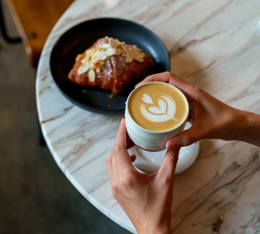 Cup of coffee with latte art at a cafe near Titan Court in Eugene, Oregon