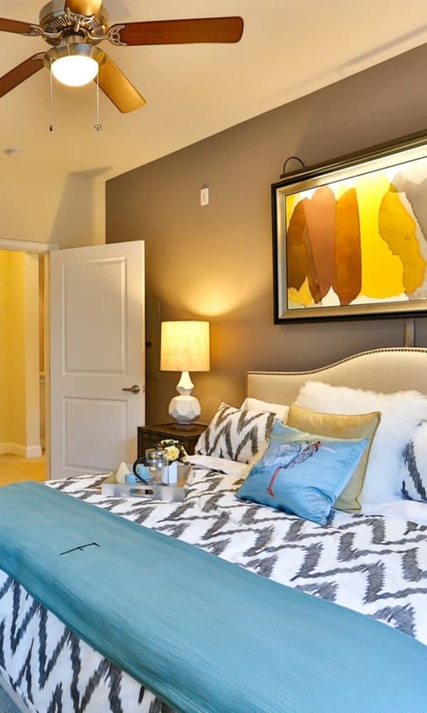 Brightly lit bedroom at Crossings at Olde Towne in Gaithersburg, Maryland