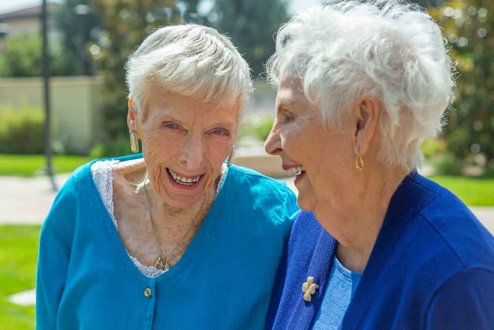 residents laughing together at Merrill Gardens at Campbell in Campbell, California. 