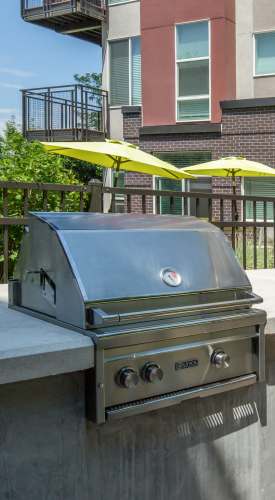 Outdoor barbeque area at Park Place Olde Town Apartments in Arvada,Colorado