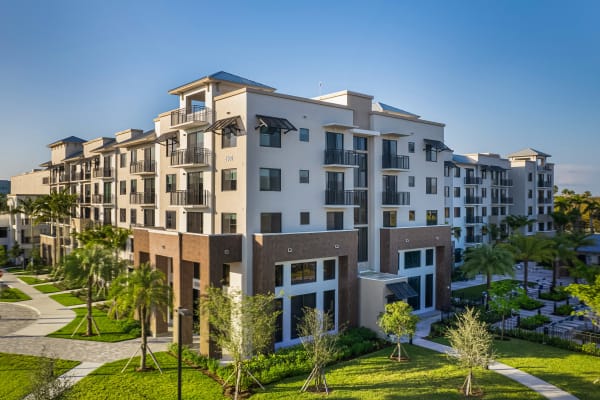 Exterior of apartment homes and parking lot at Shalimar at Plantation in Plantation, Florida