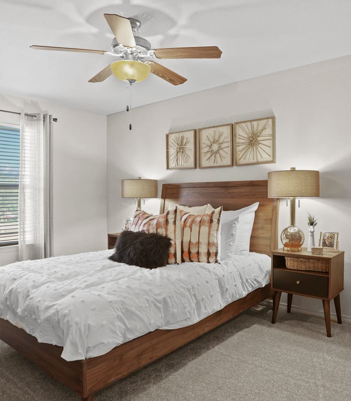 Chic bedroom with ceiling fan at Cottages at Crestview in Wichita, Kansas