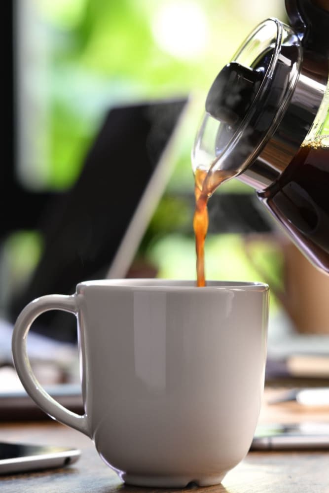 Pouring coffee at Auburn Villas Senior Apartments in Auburn, California