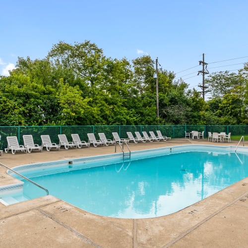 Swimming pool with sundeck lounge seating at Monroe Terrace Apartments in Monroe, Ohio