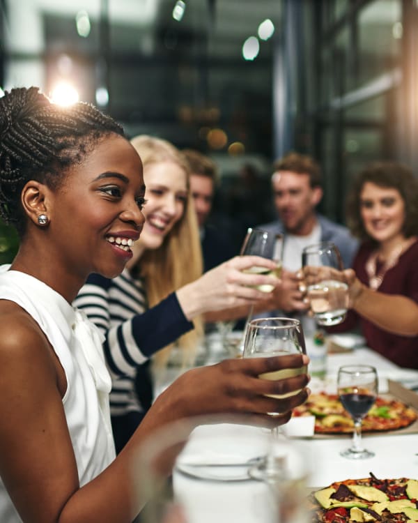 Friends eating out at a local restaurant near Encore 281 in San Antonio, Texas