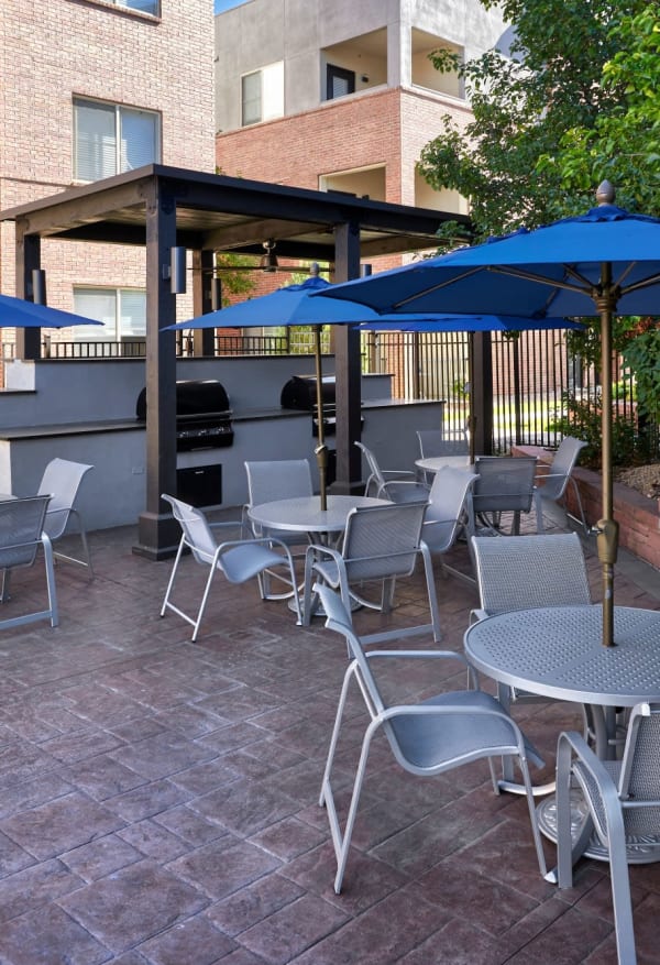 Grilling area with lots of seating for you and friends at Marq Inverness in Englewood, Colorado