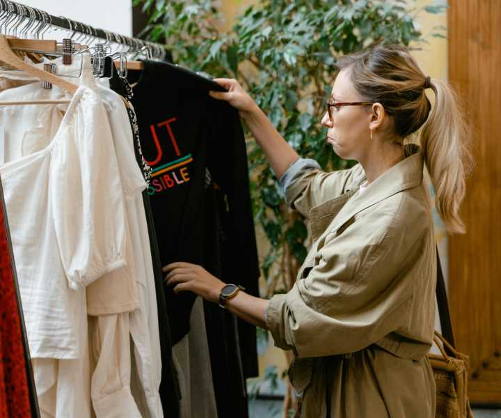 Woman looking for clothes in a shop near Cypress in McKinney, Texas