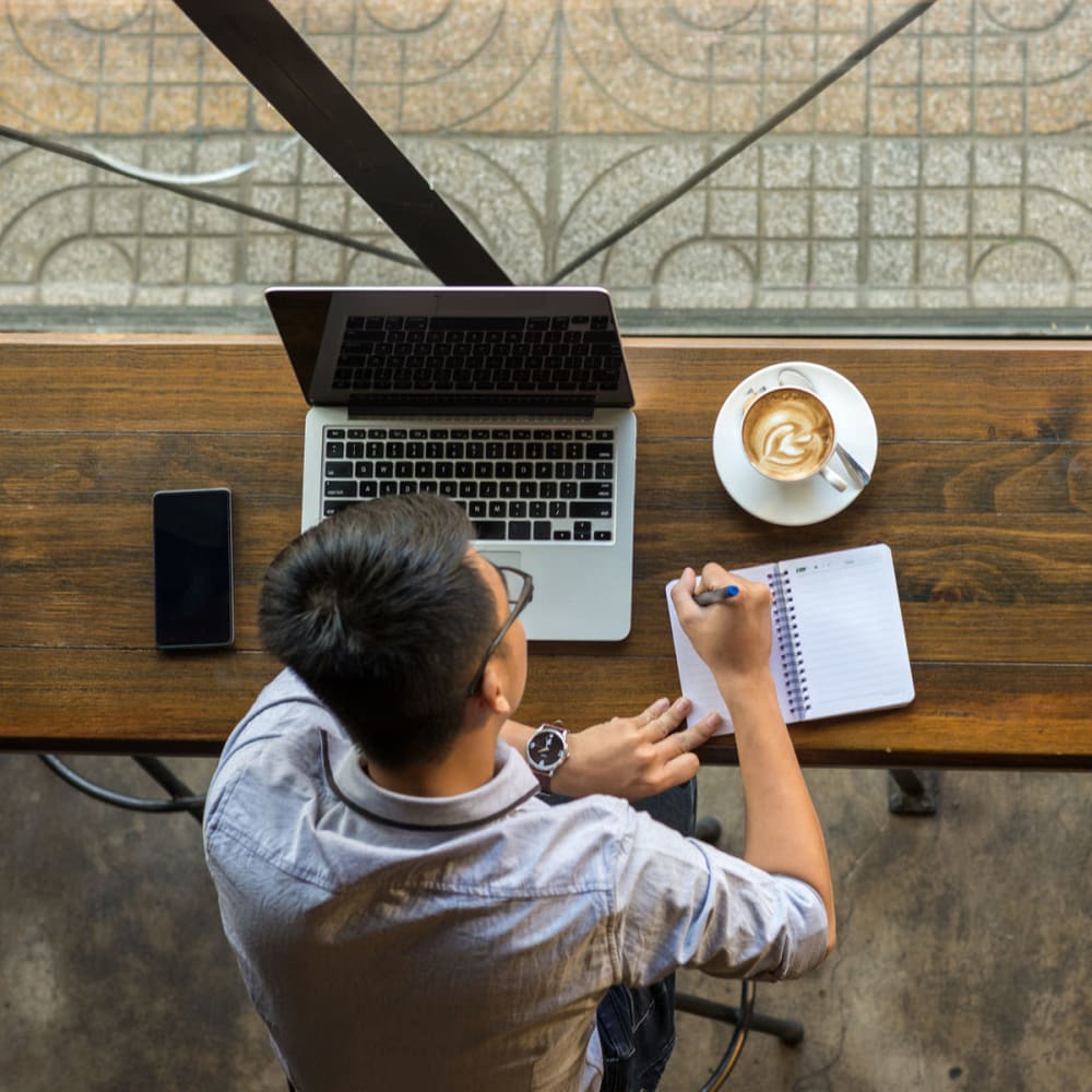 Resident getting some work done from his favorite café near Oaks Glen Lake in Minnetonka, Minnesota