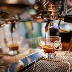 Espresso pouring into a glass cup at Latitude at South Portland in Portland, Maine