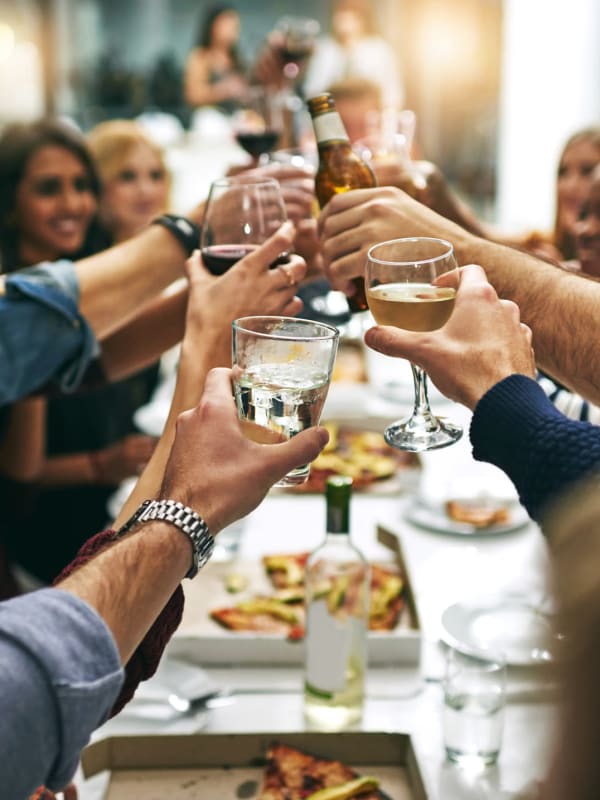 residents cheers wine glasses near Keizer Station Apartments in Keizer, Oregon