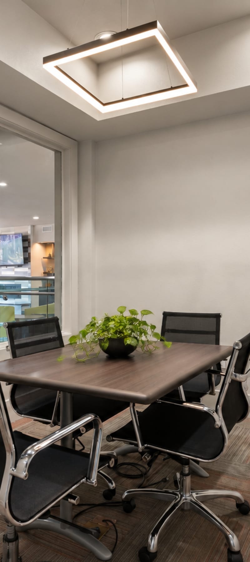 Private study room with conference table at The Den in Columbia, Missouri