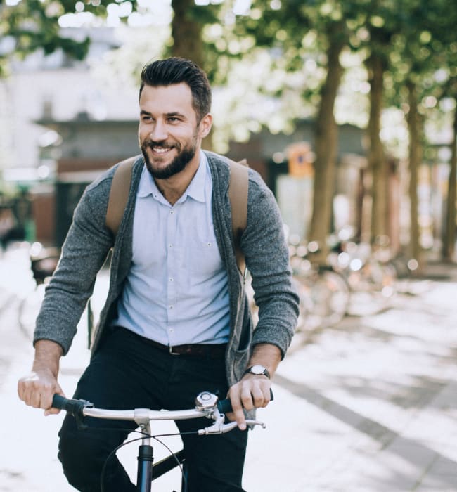 Resident riding his bike around town near Marq Inverness in Englewood, Colorado