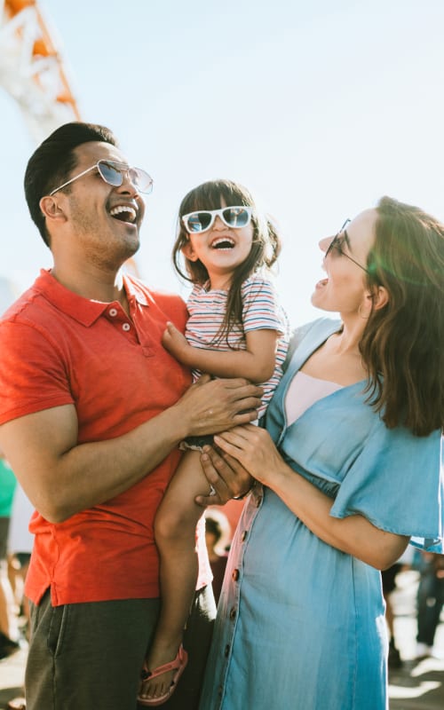  A family laughing near Instrata at Legacy West in Plano, Texas