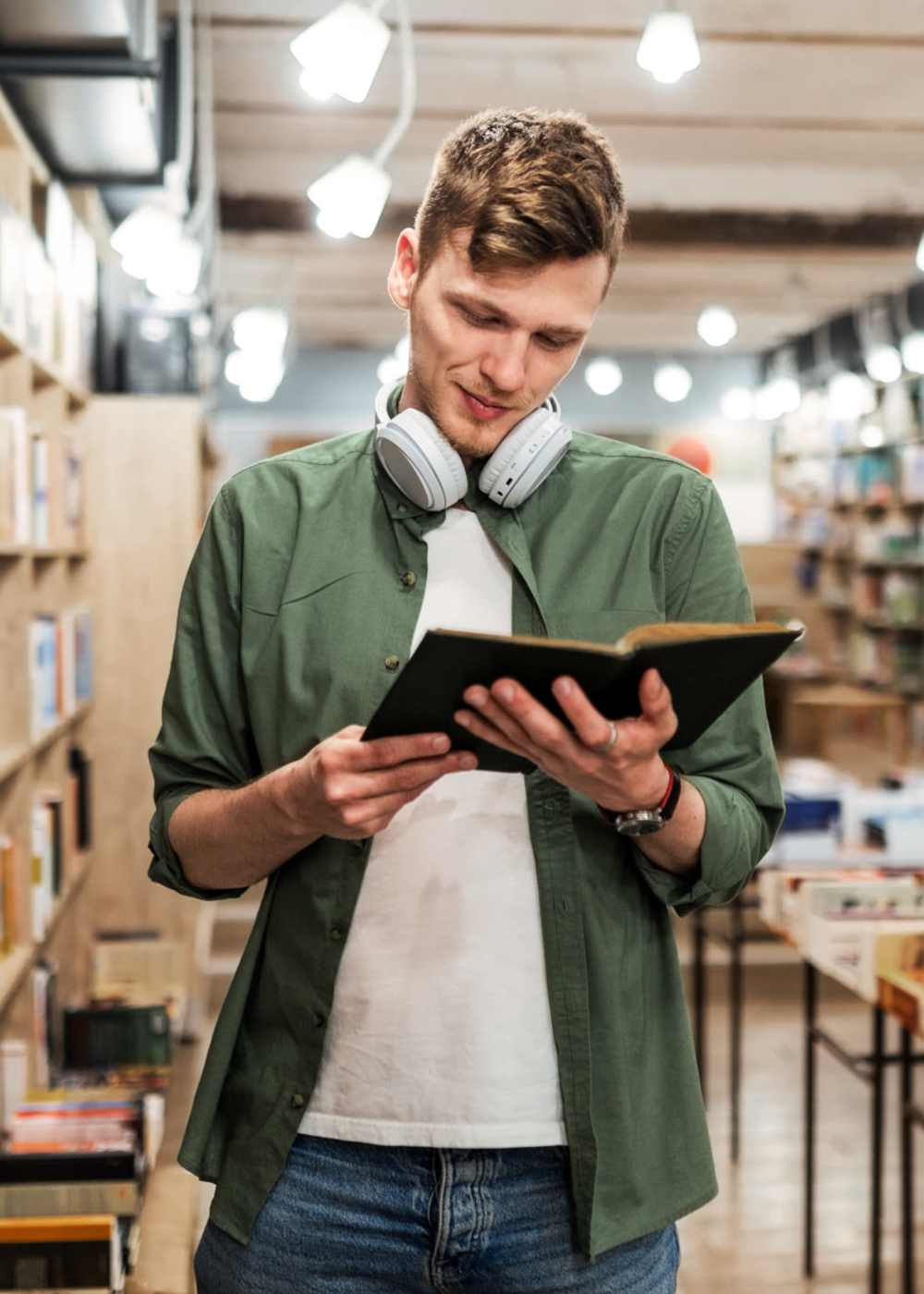 A resident student reading book in library near M2 Apartments in Denver, Colorado 