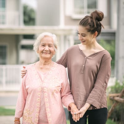 Younger caretaker with a resident at The Creekside in Woodinville, Washington