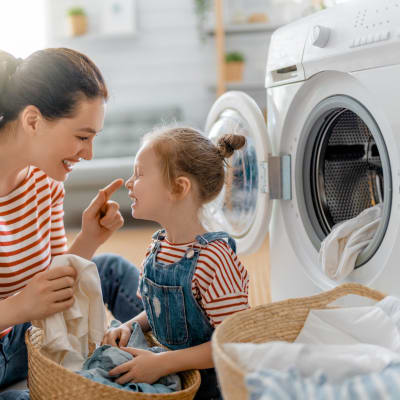 a mother and daughter doing laundry at Evergreen in Joint Base Lewis McChord, Washington