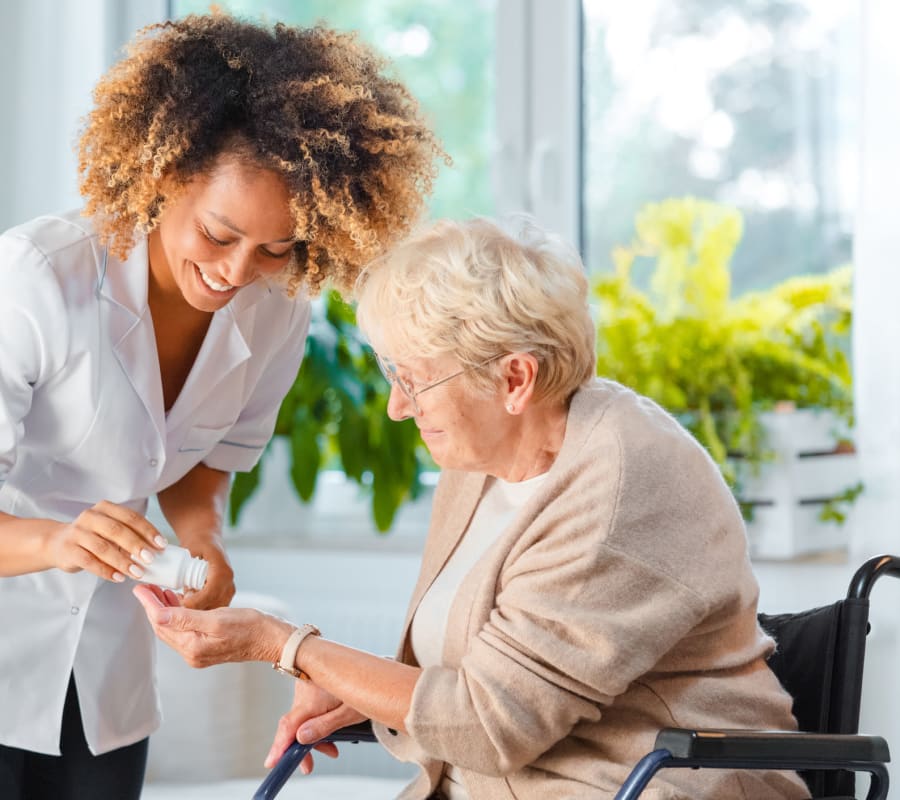 Resident receiving medication at Barnett Woods in Medford, Oregon