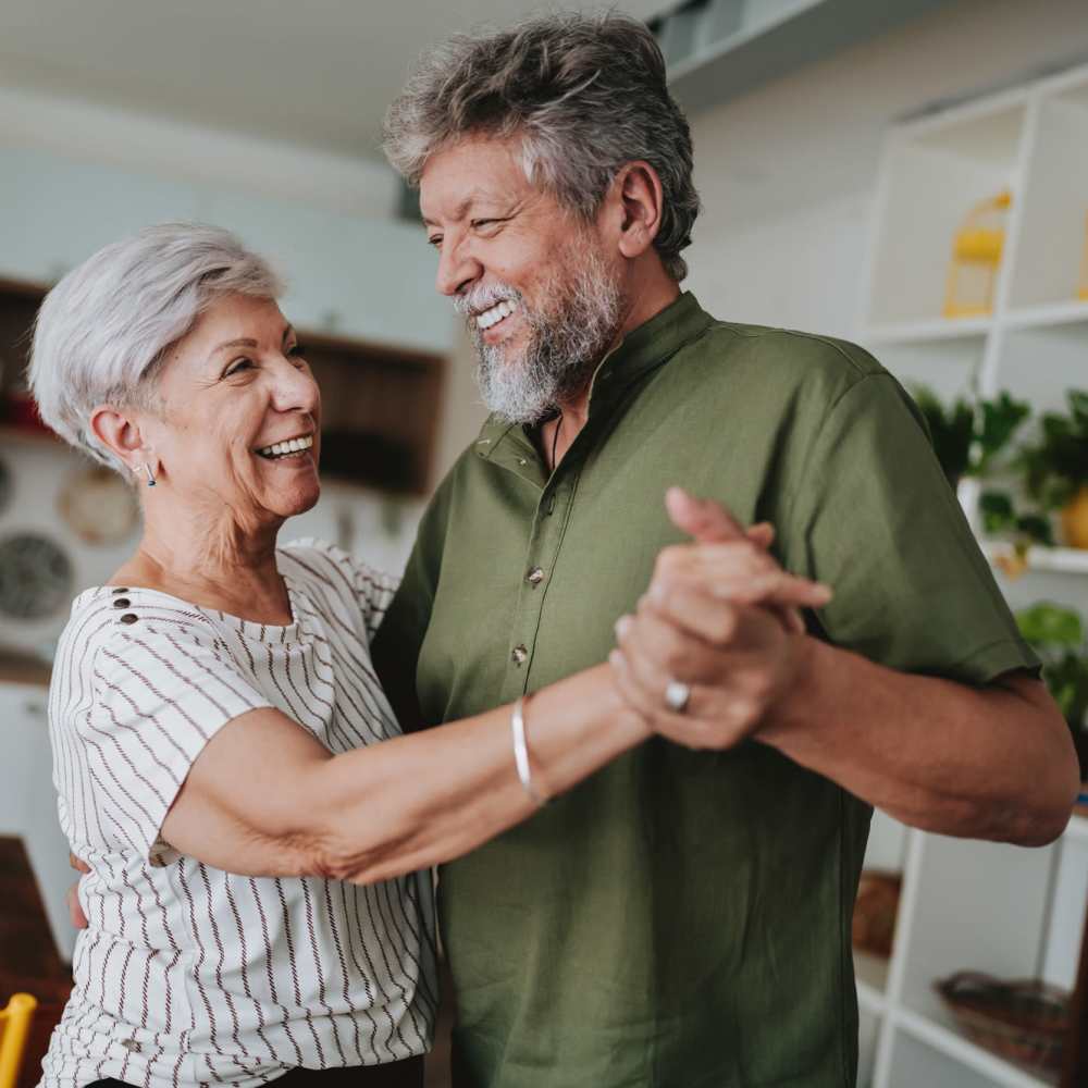 Residents dancing happily at Willow Creek Apartments in Escanaba, Michigan
